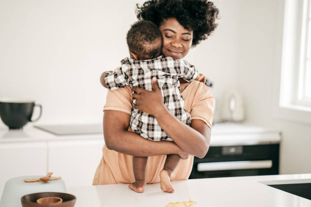 istock Mom playing with baby son 1165361030