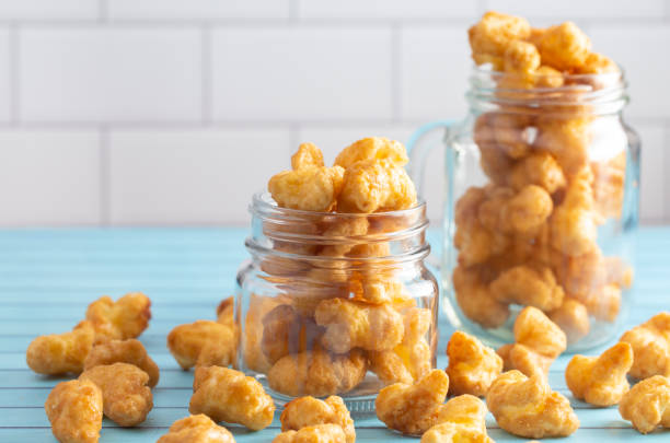 istock Caramel Puff Corn Popcorn in Glass Jars 1165361070