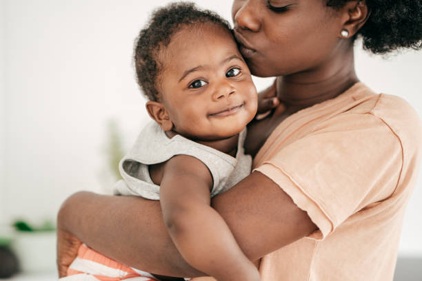 istock Mom playing with baby son 1165361079