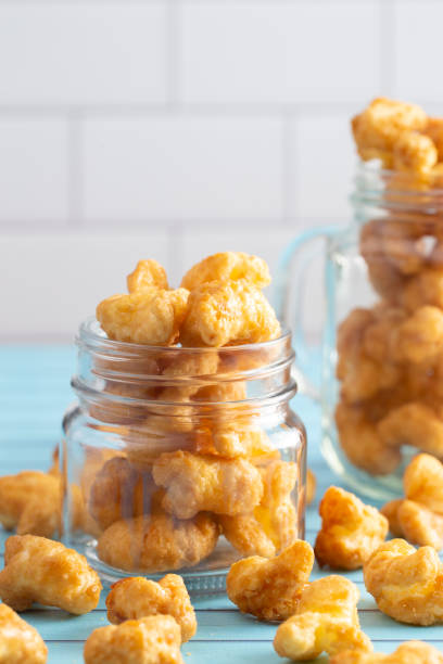 istock Caramel Puff Corn Popcorn in Glass Jars 1165361151