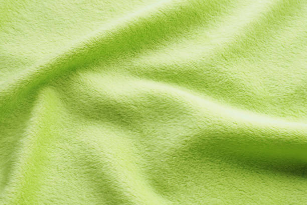istock background light green plush with folds. 1165361403