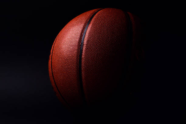 istock basketball ball on black background. 1165362186