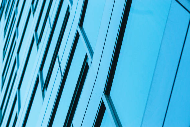 istock Office building windows background. Glass facade of an office building 1165362609