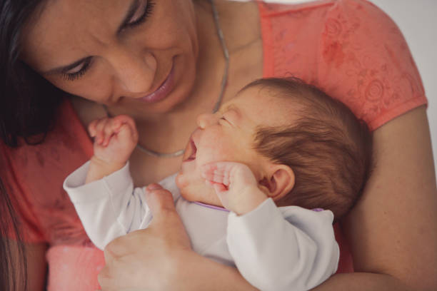istock Newborn baby girl crying 1165363948