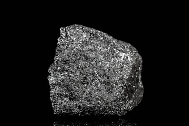 istock Raw and unrefined silicon element in front of black background, mining and mineralogy 1165364386