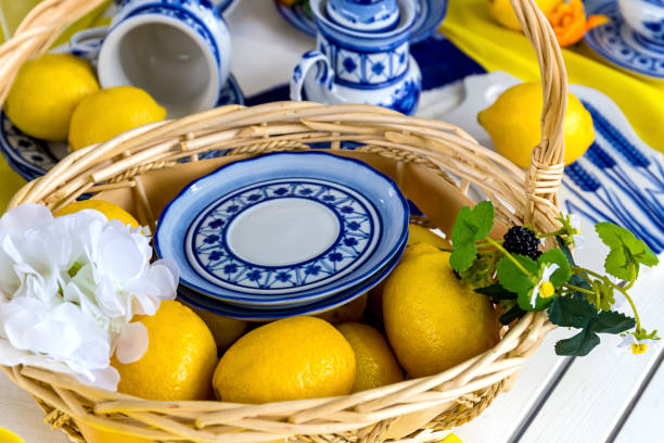 istock Composition with lemons on a blue plate.Fresh yellow lemons 1165364498