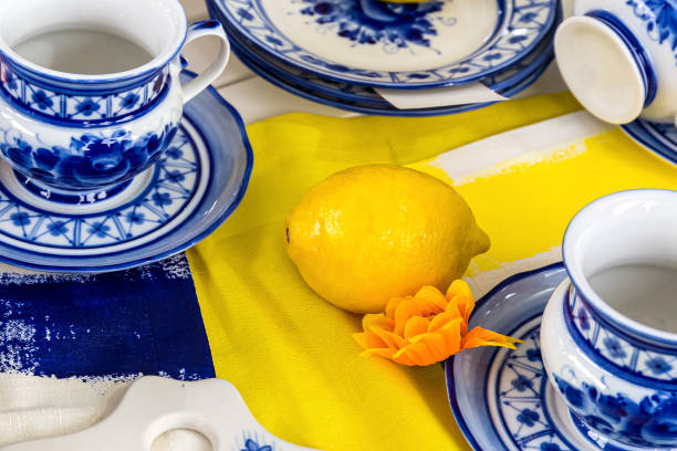 istock Composition with lemons on a blue plate.Fresh yellow lemons 1165364504
