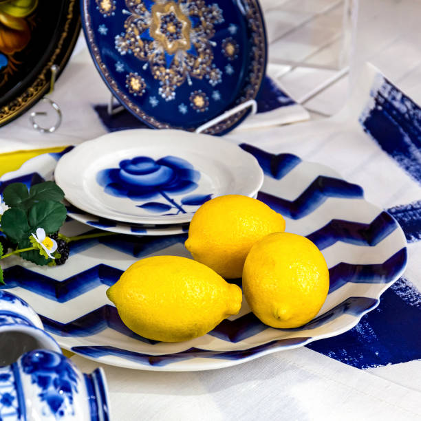 istock Composition with lemons on a blue plate.Fresh yellow lemons 1165364516