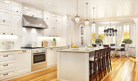 Cocina blanca de lujo y comedor en una gran casa hermosa photo