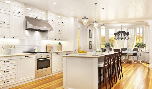 istock Luxury white kitchen and dining room in a large beautiful house 1165365520