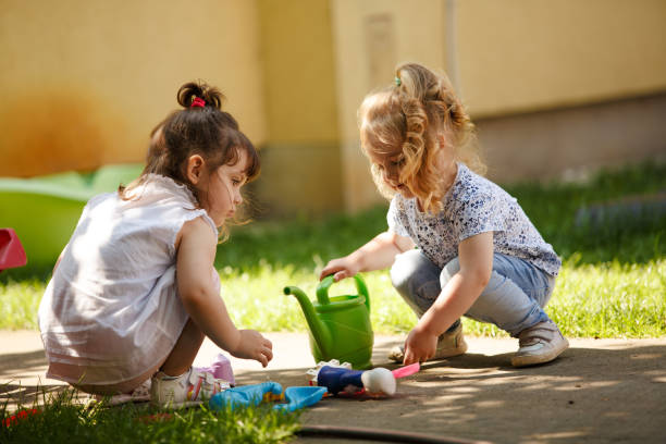 istock Two adorable little girls having fun 1165366814