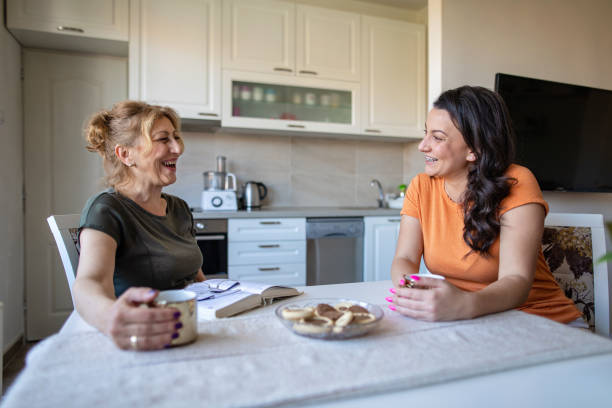 istock Daughter asking her mother how is her day going 1165368808