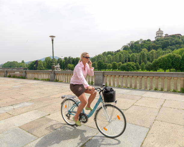 Business woman commutes to work on bicycle