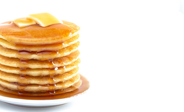 istock Stack of Freshly Made Buttermilk Pancakes with Syrup and Butter Isoalted on a White Background 1165369950
