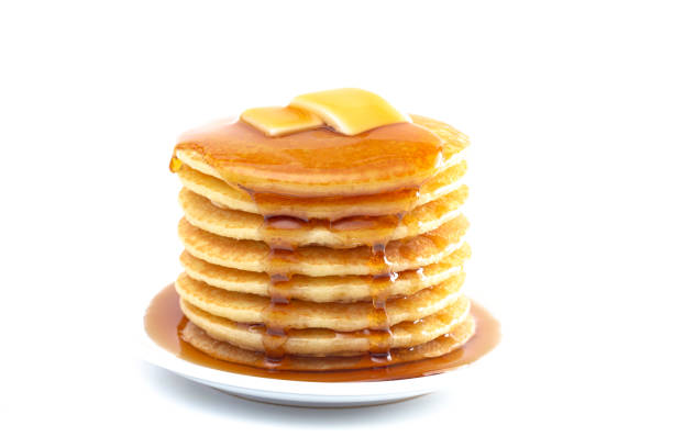 istock Stack of Freshly Made Buttermilk Pancakes with Syrup and Butter Isoalted on a White Background 1165369982