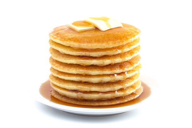 Large stack of pancakes dripping with syrup with clipping path.  Please see my portfolio for other food and drink images. 