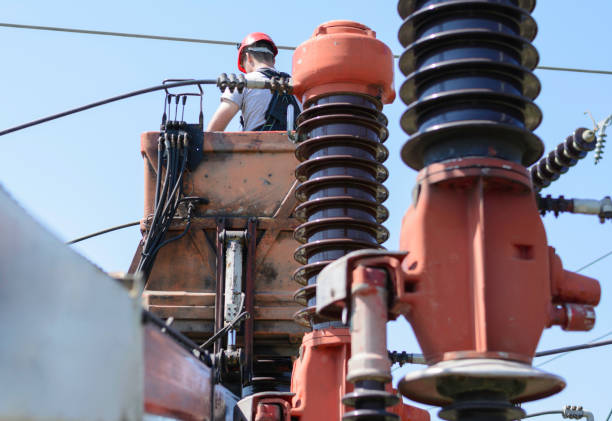 istock Electrician working on circuit braker in power substation 1165370257
