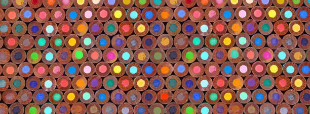 Photo of Color pencils in multicolored background patterned abstract circles back to school