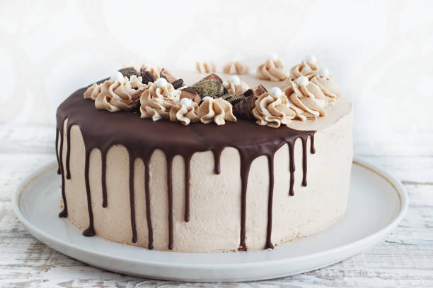 istock Chocolate Cake with Fudge Drizzled Icing and Curls 1165371260