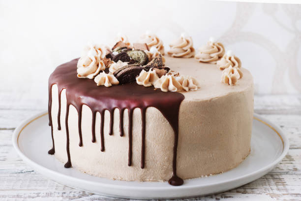 istock Chocolate Cake with Fudge Drizzled Icing and Curls 1165371261
