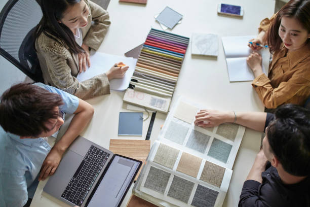 istock Young Chinese Creatives Making Color and Fabric Choices 1165373919