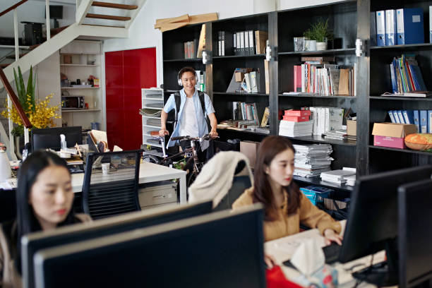 istock Casual Asian Male Worker Commuting to Office by Bicycle 1165373943