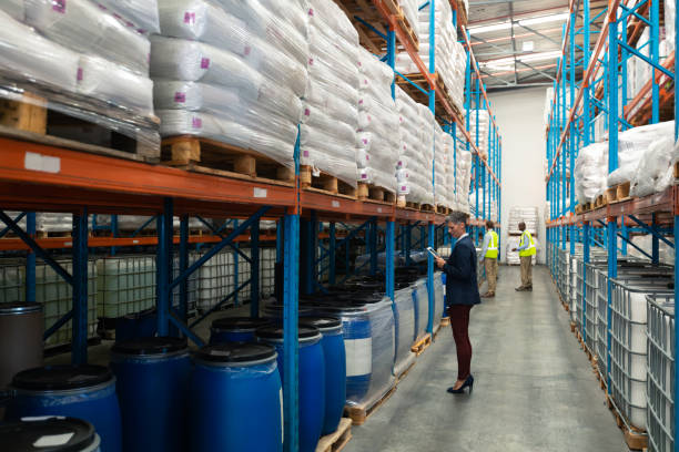 istock Warehouse staff checking stocks in warehouse 1165374927
