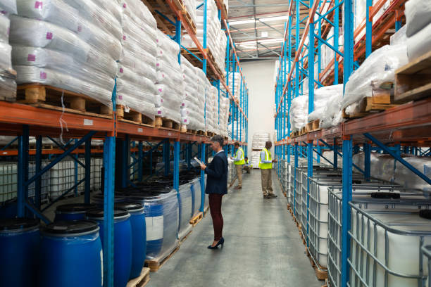 istock Warehouse staff checking stocks in warehouse 1165374962