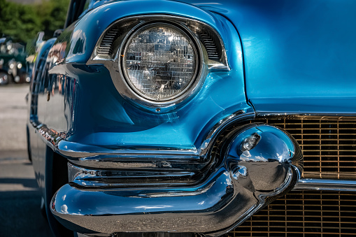 Front view of a vintage car in blue