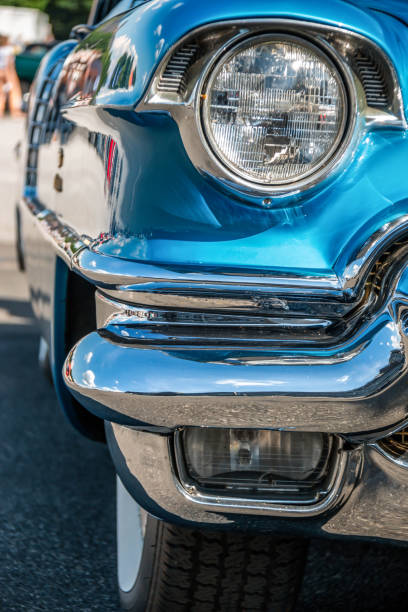 istock Headlight and bumper of a classic car 1165375271