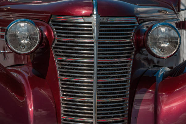 istock Vintage car detail in red front 1165375272