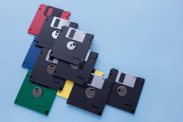 istock Multi-colored flexible disks isolated on a blue background. Copy space for your text. 1165376355