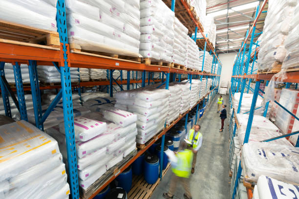istock Warehouse staff checking stocks in warehouse 1165376540