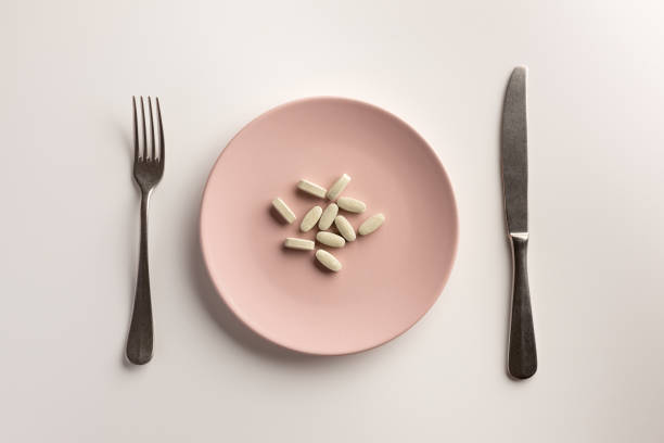istock Dietary supplements on the plate. Flat lay. 1165376814