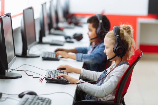 istock Mixed Racial group Of Elementary School Children In Computer Class 1165379844