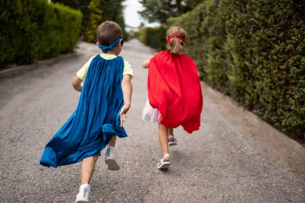 Children pretending to be superheroes