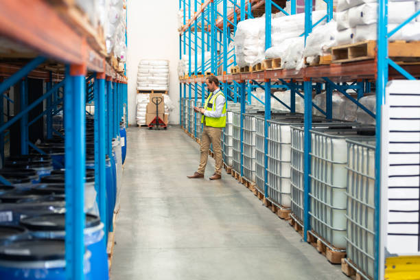 istock Male worker standing in warehouse 1165382756