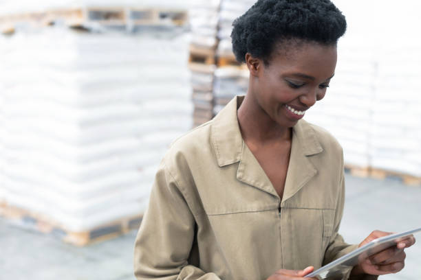 istock Female worker working on digital tablet in warehouse 1165383941