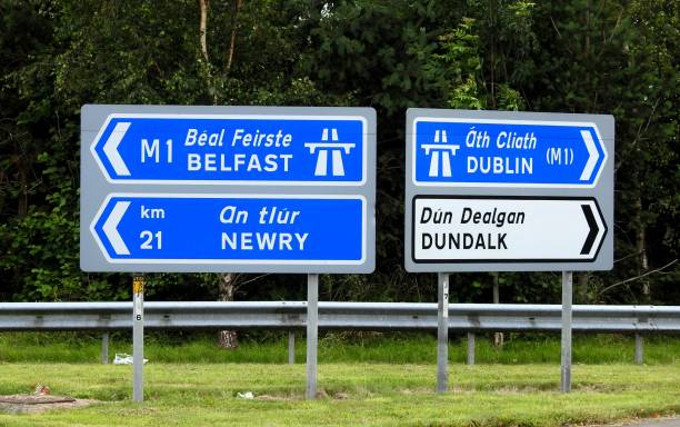 Road signs Belfast, Newry, Dublin and Dundalk directional road signs. northern ireland photos stock pictures, royalty-free photos & images