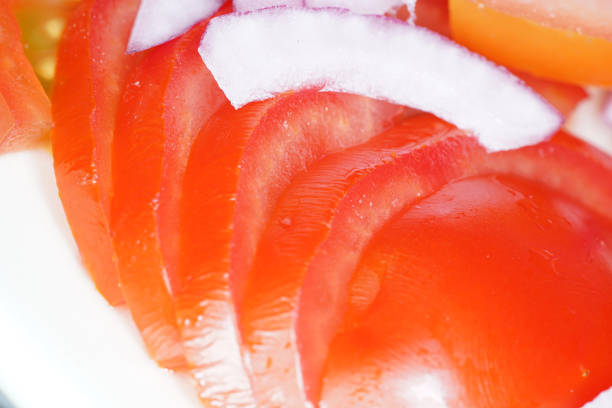 This is a onion and tomato salad with washed tomatoes and peeled onion