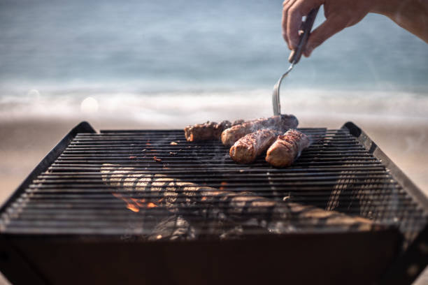 istock beach bbq with sea on the background 1165387076