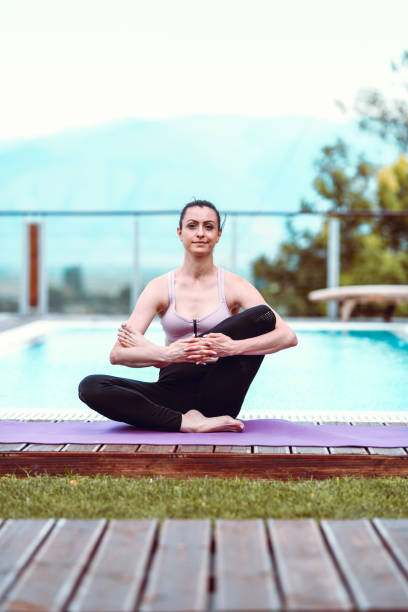 istock Female Demonstrating Hard Yoga Positions 1165387307