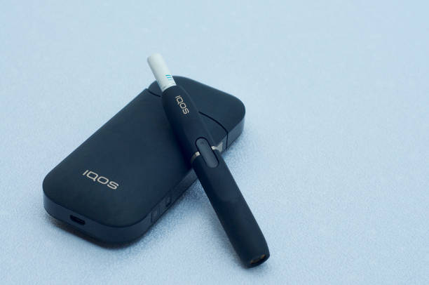 IQOS electronic cigarette with heat-not-burn system stock photo