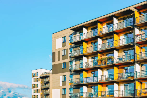 istock Apartment EU home residential building copy space blue sky 1165391863