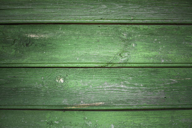 Grungy dark green wooden wall background photo texture with vignette effect