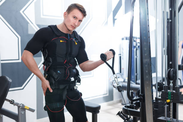 istock Sporty man performing full-body EMS training 1165393599