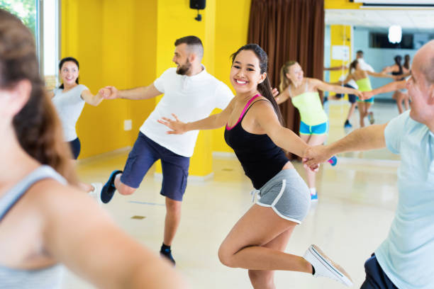 istock Happy men and women enjoying active dance 1165393953
