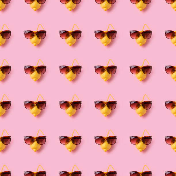 istock Photography collage lemon vacation in sunglasses on pink background seamless pattern 1165394930