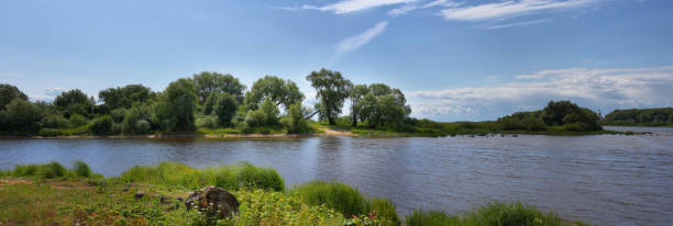 istock Large-format summer panorama with a river and a picturesque shore 1165397806