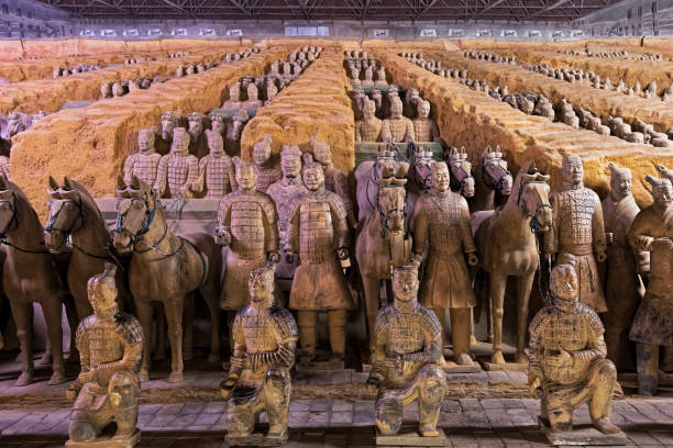 World famous Terracotta Army located in Xian China The world famous Terracotta Army, part of the Mausoleum of the First Qin Emperor and a UNESCO World Heritage Site located in Xian China terracotta soldiers stock pictures, royalty-free photos & images